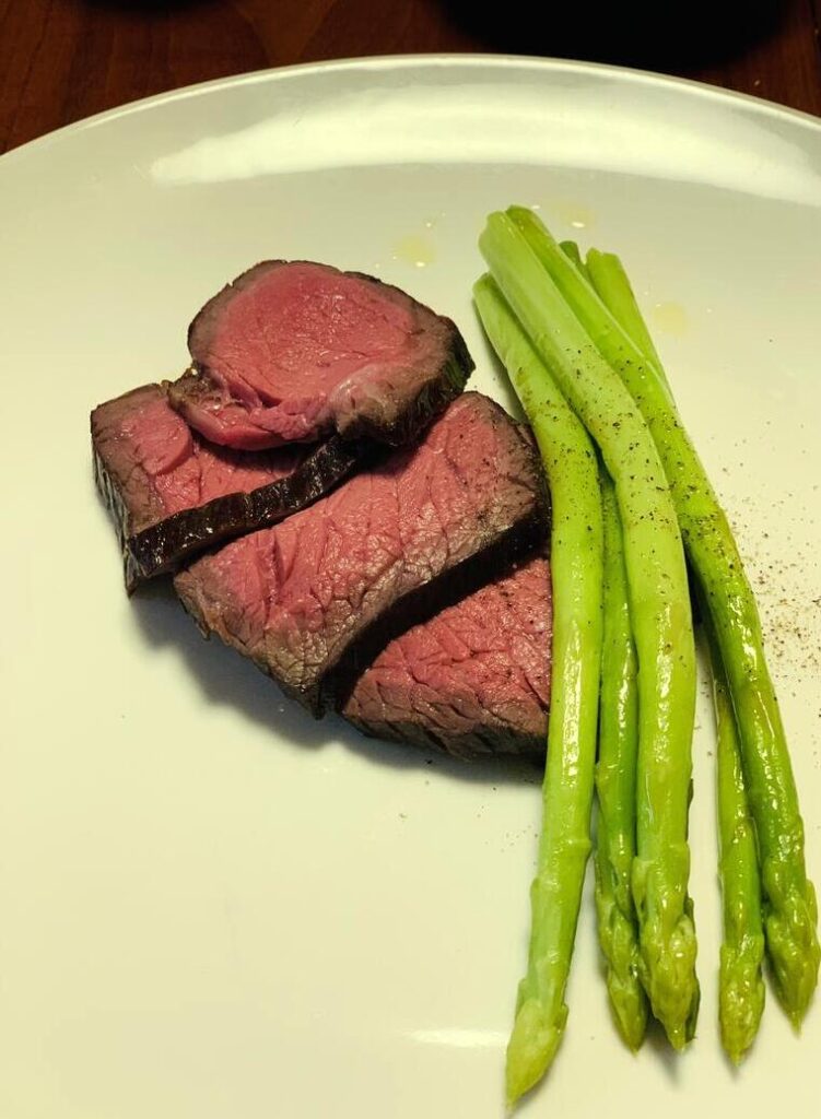Cook beef at 133 for 3 hours - steam asparagus at 180 for 10 minutes. Sous vide is amazing!