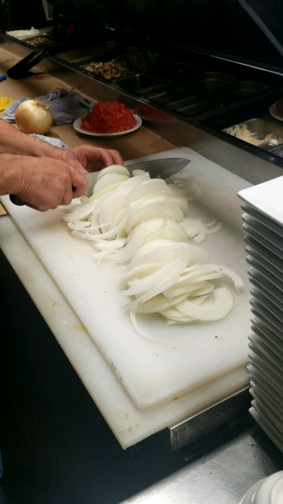 My uncle who is a restaurant owner prepping onions