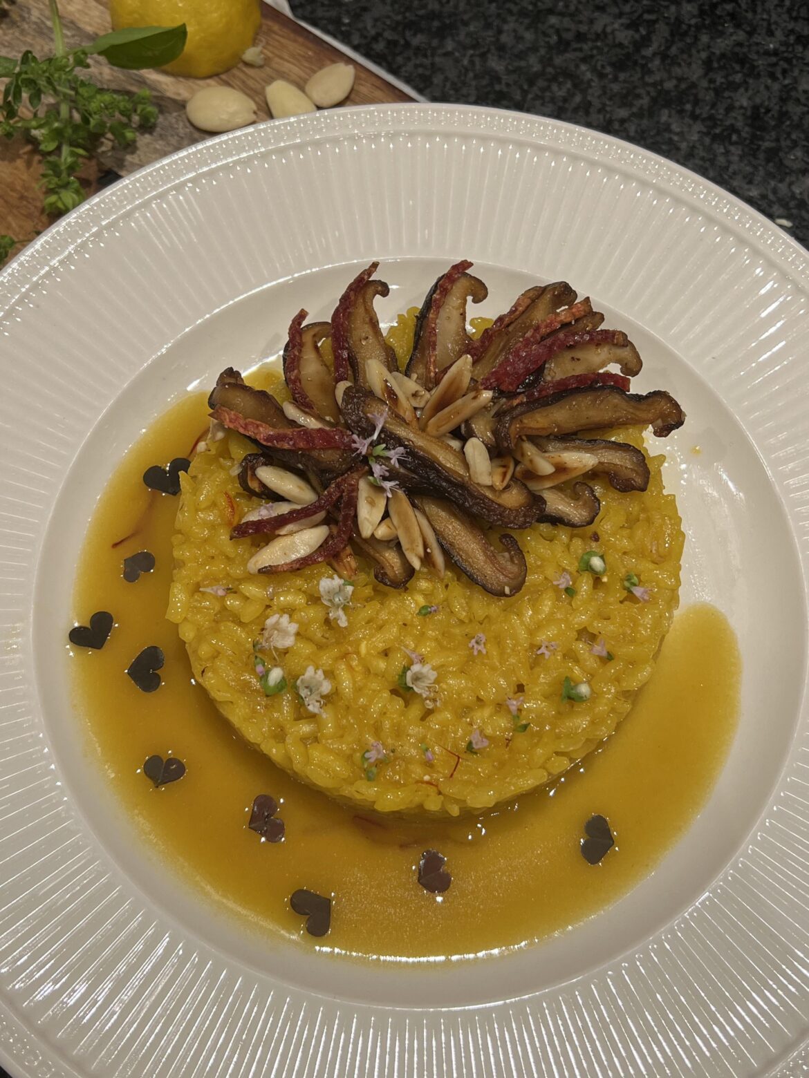 Risotto ala Milanese with shiitake, almonds and chioggia beet and lemon saffron velouté