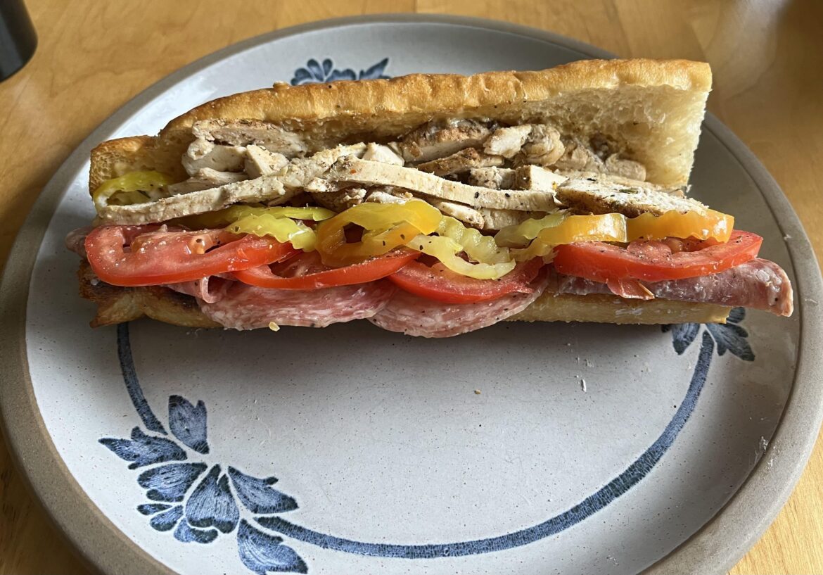 Roasted chicken, banana peppers, tomatoes, goat cheese and salami.