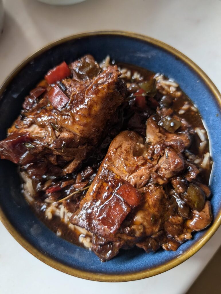 Brown stew chicken & rice and peas