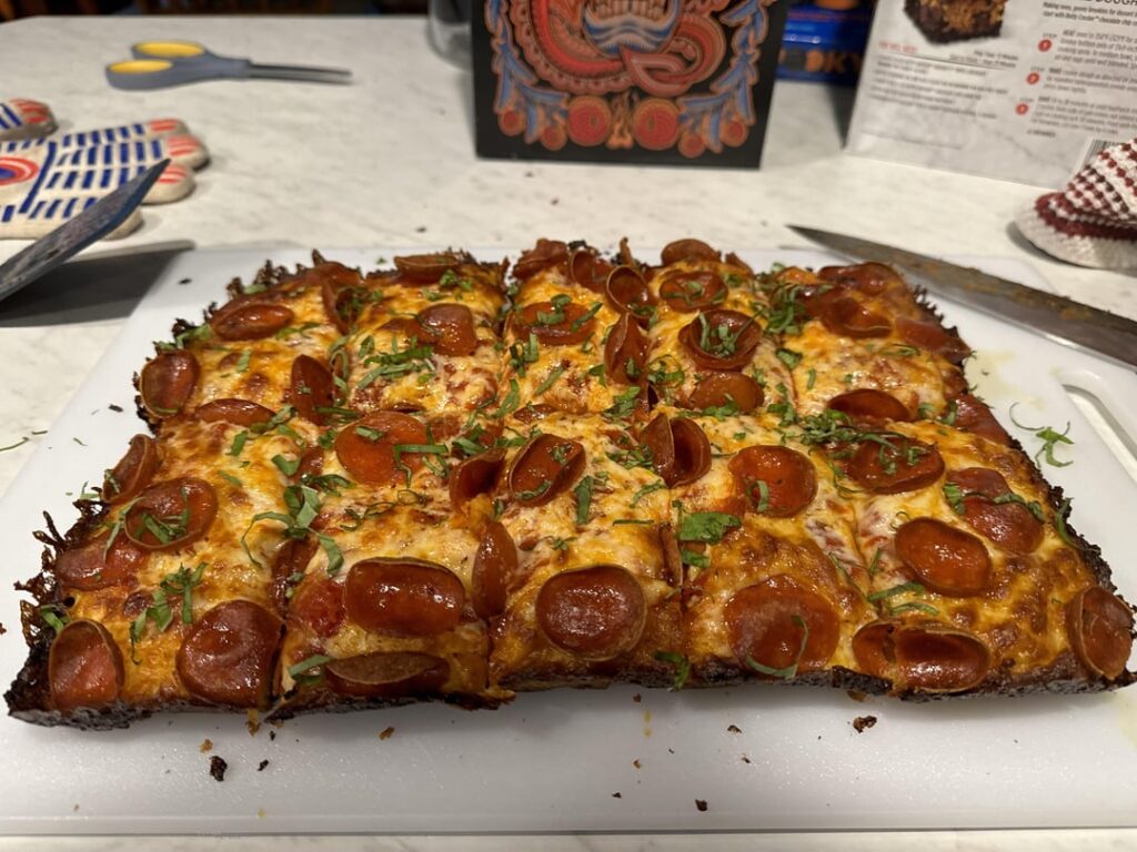 Detroit Style Pizza with cupping pepperoni and basil