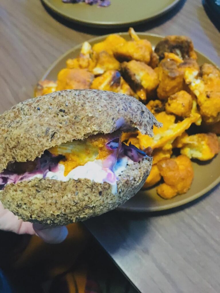 Cauliflower wings on a bun with ranch slaw...