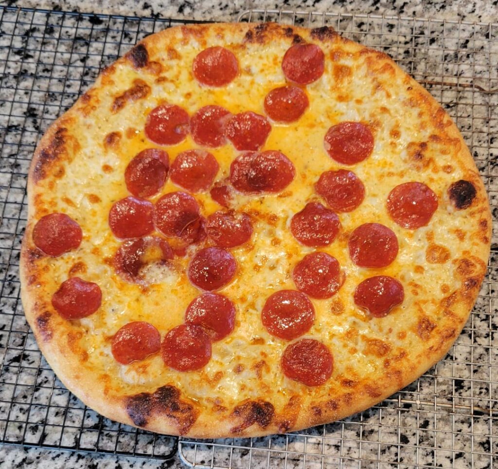How does my home oven pizza look? 16" NY style on pizza stone