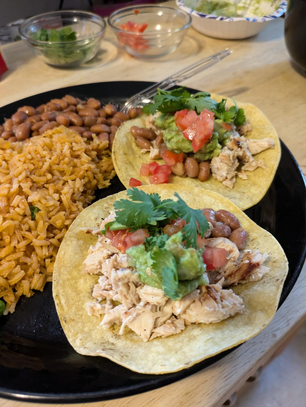 Homemade tacos, beans and rice