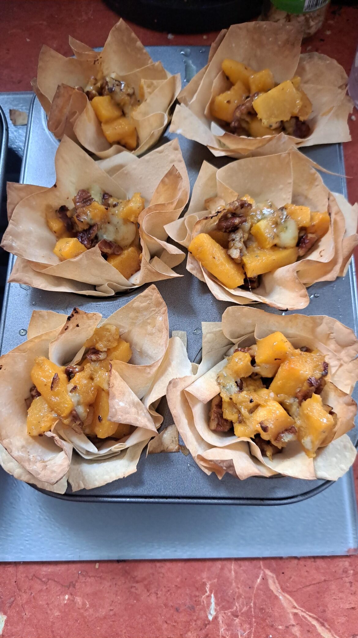 Blue cheese and squash tarts.