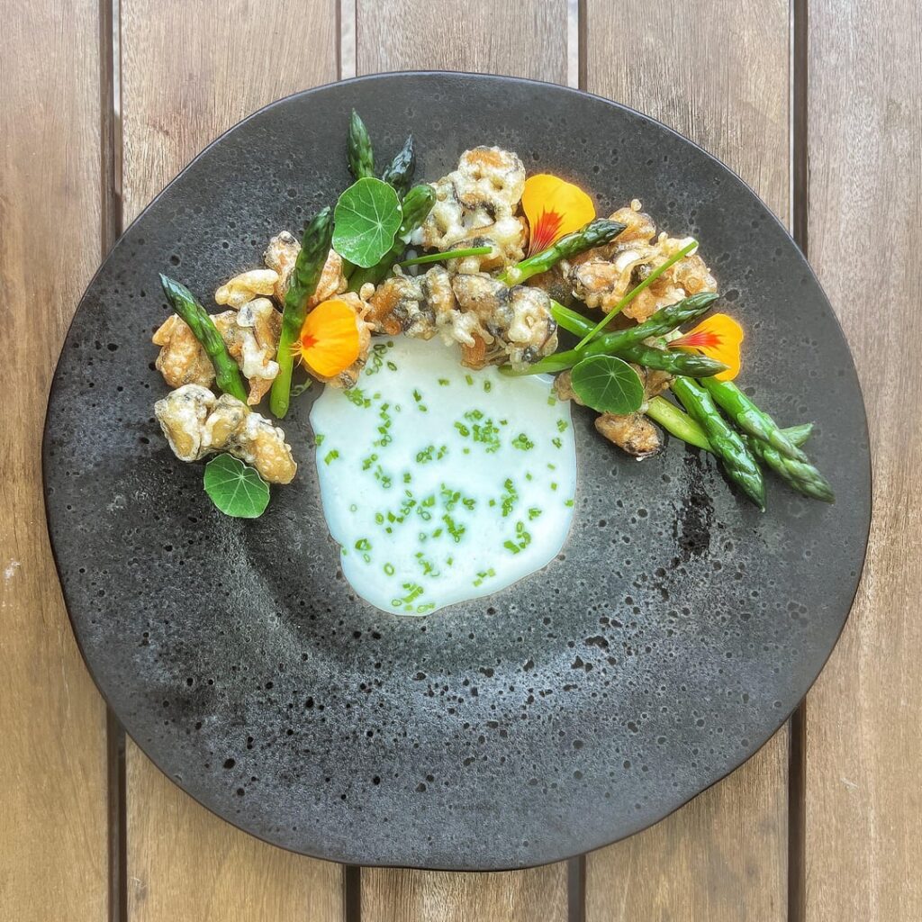 mussels tempura, green asparagus, champagne sauce, nasturtium