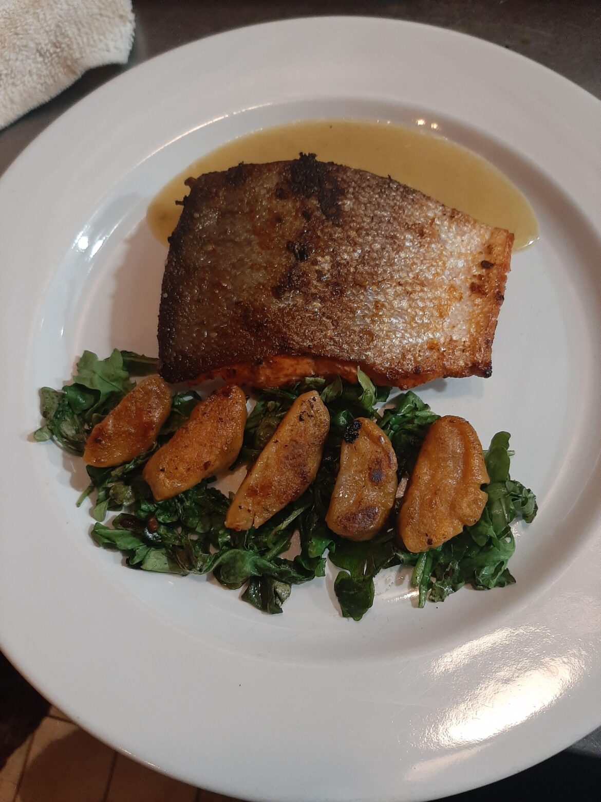 Chipotle Salmon, Lime Beurre Blanc, Wilted Arugula, Sweet Potato Gnocchi