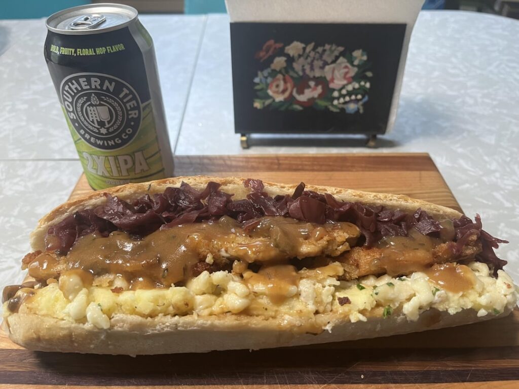 Jager schnitzel with rotkohl (sweet and sour red cabbage) on kasespatzle (cheesy dumplings)and  mashed potatoes, and topped with a mushroom ragout, on a baguette  And my kid found a giant puffball today so I schnitzeled up a slice of that too.