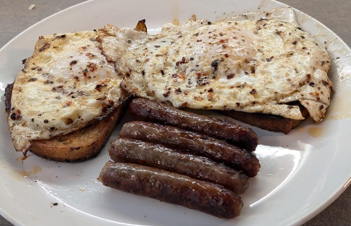 Coupla fried boys on grilled bread with links.