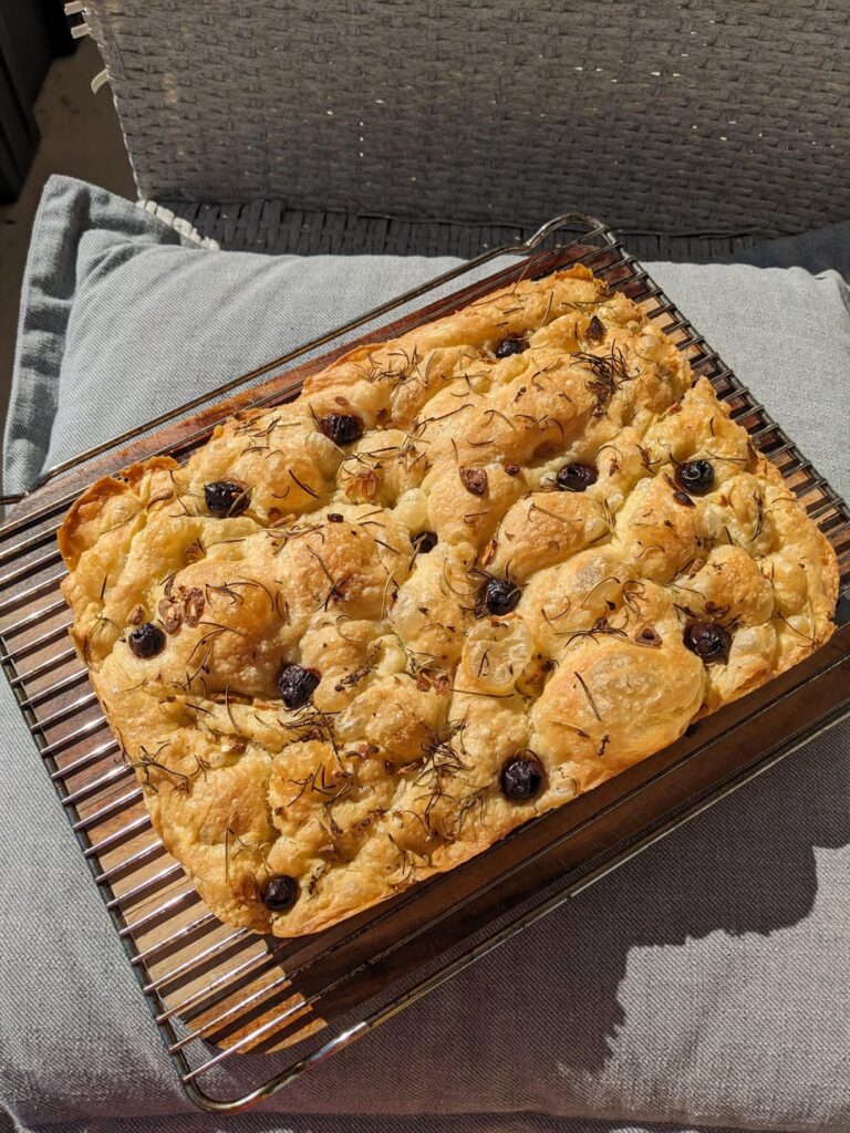 My first focaccia, she's a beauty, so bubbly and crispy!
