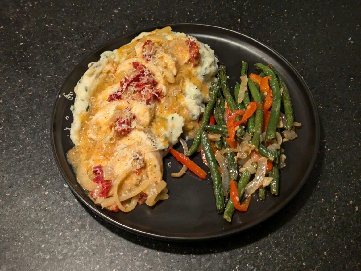 Creamy Black Pepper Toscano Chicken; Roasted Garlic and Chives Mashed Potatoes; Sauteed Veggies