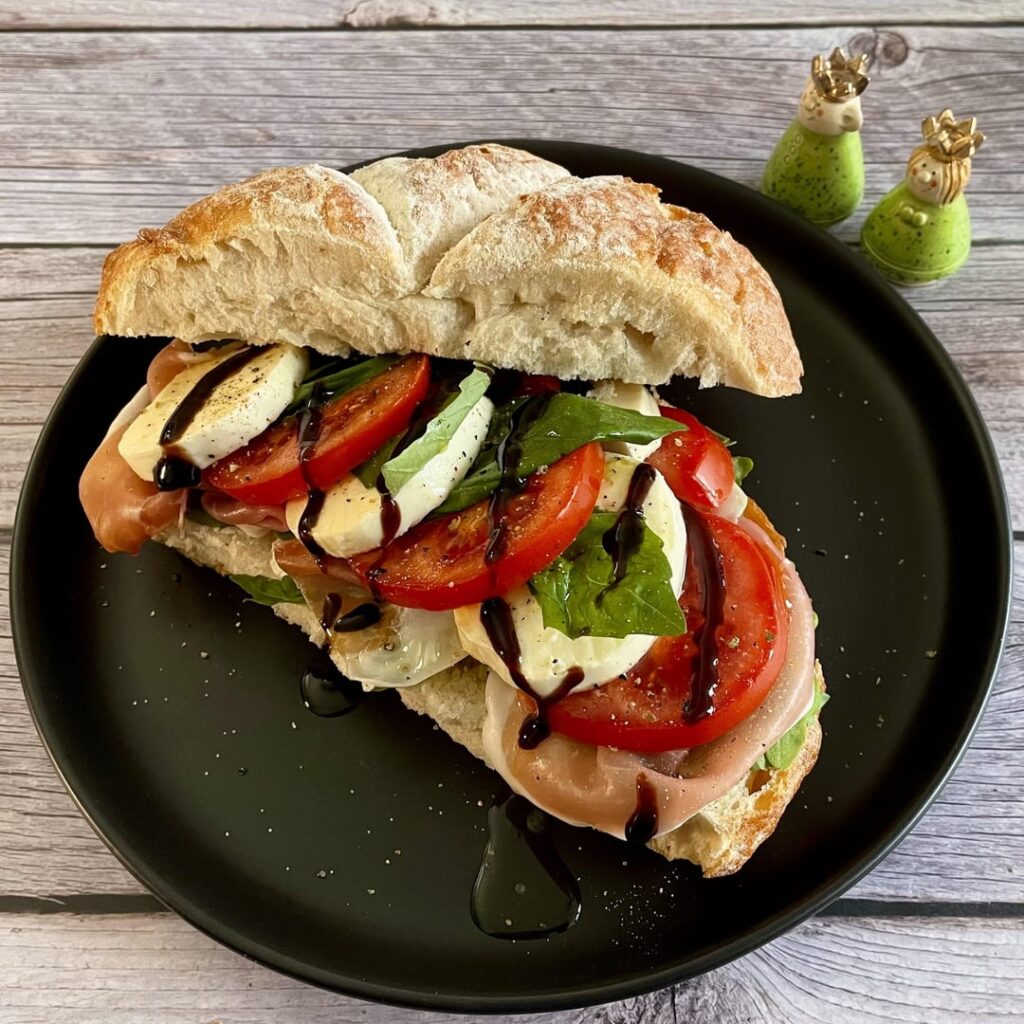 Tomato mozzarella sandwich with prosciutto