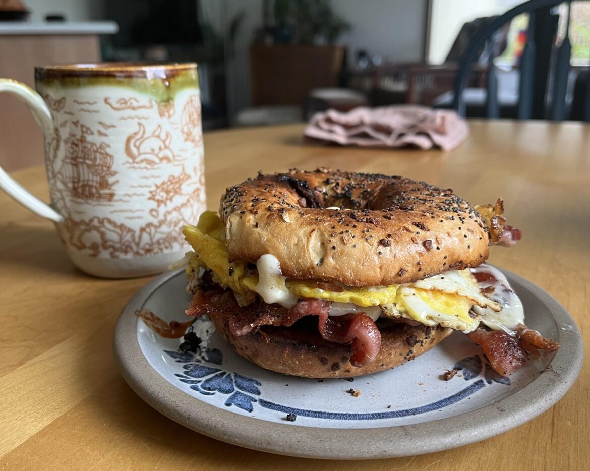 Bacon, eggs, cheese, everything bagel, hot sauce.