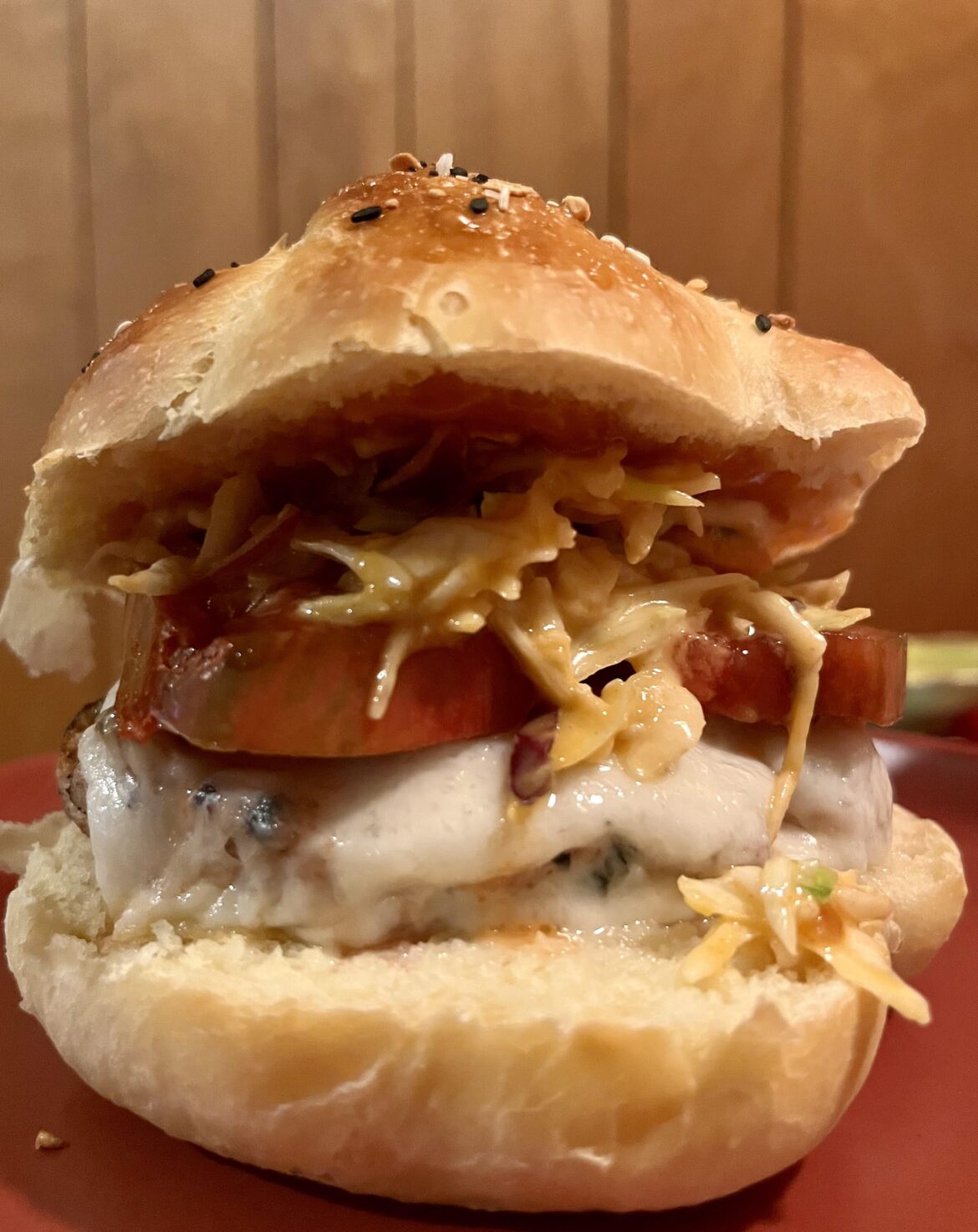 Grilled chicken burger, goat cheddar, peach butter, gochujang slaw, shallots, and a homegrown Kellogg’s Breakfast tomato on a challah bun my wife baked about 15min ago. Sunday Scaries obliterated!!!