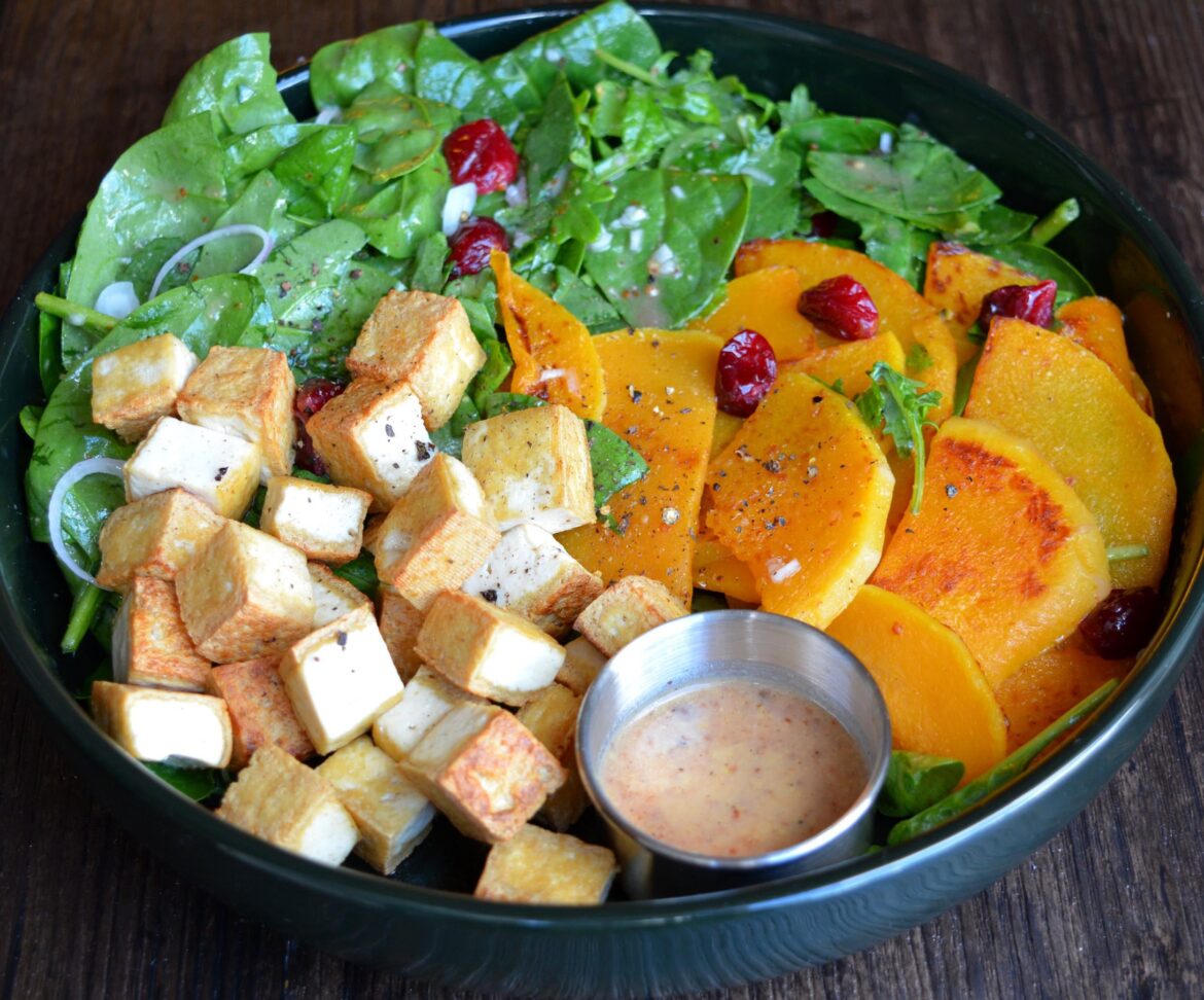 351 cal, 24 P lunch. Crispy tofu, cranberry vinaigrette w shallots on kale mix, pan roasted butternut squash