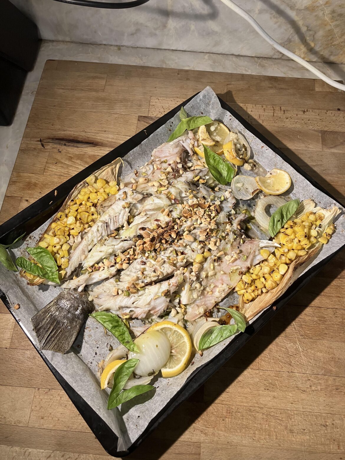 Seabass, grilled corn, parsley oil, peanuts & pistachios