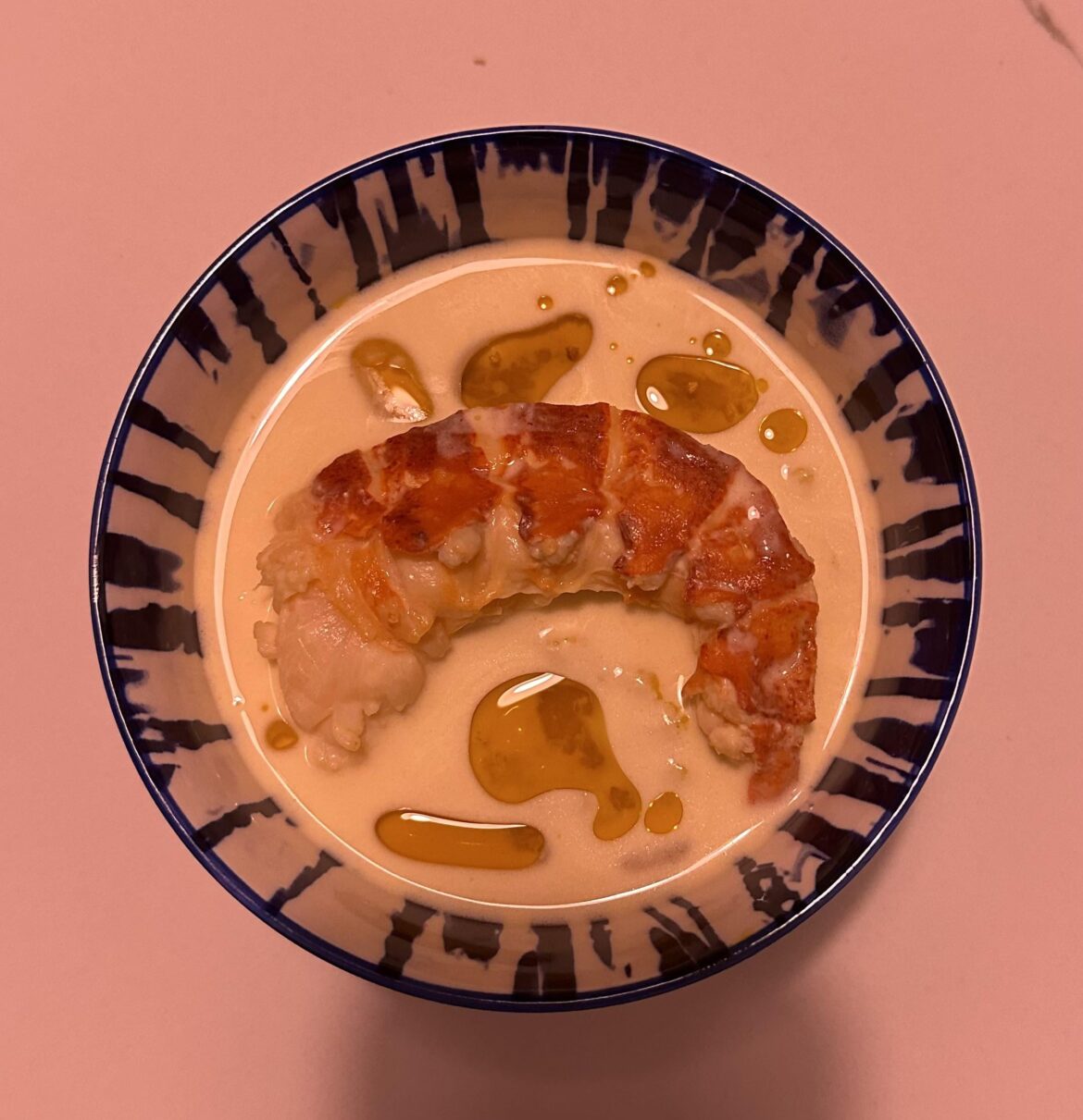 Butter poached lobster tail, yuzu dashi beurre blanc, & lobster oil over Kabocha purée