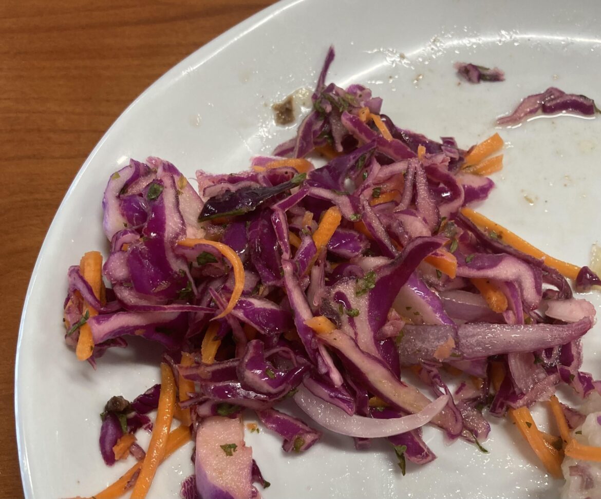 Awesome red cabbage and onion lime slaw served at my college food court!