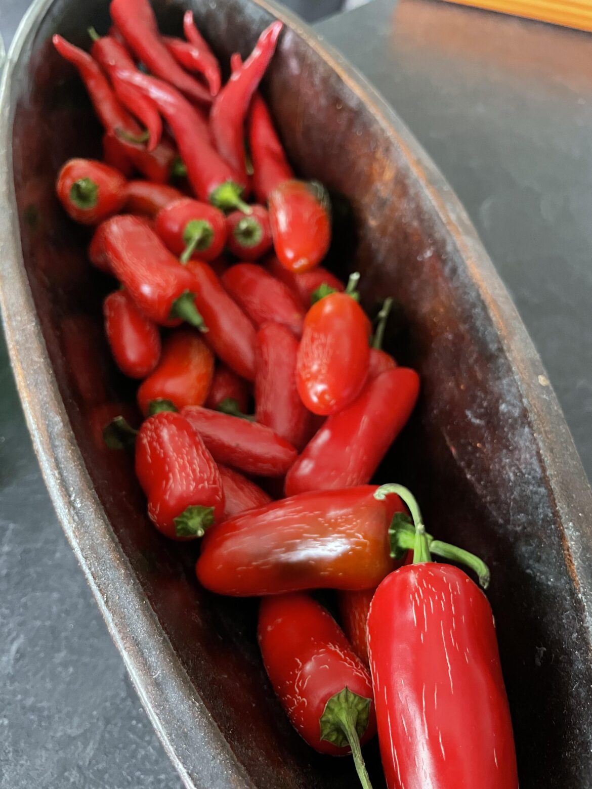 Is it possible, that my Jalapeños only taste spicy after being cooked?