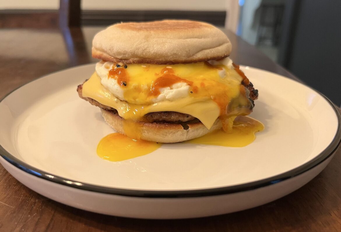 Runny egg breakfast sandwich.