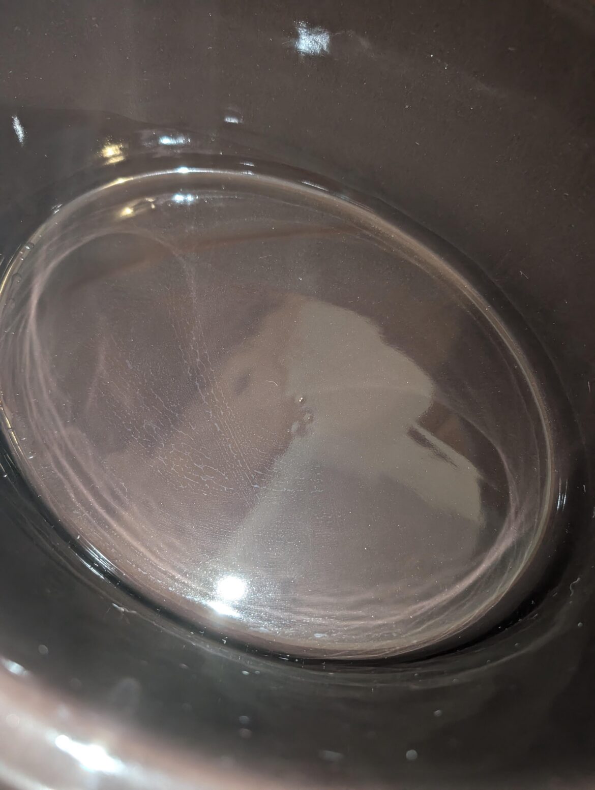 Fresh out of the box, stoneware has this tiny spot of missed glaze. Still safe to use I assume?