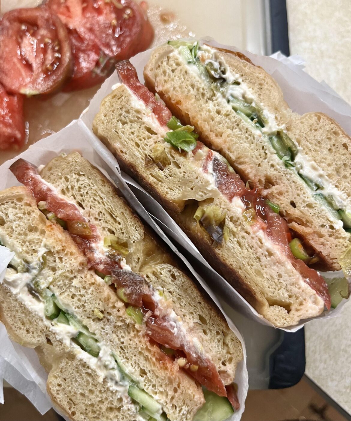 Homemade roasted pepper bagels with pepper jack on top, veggie cream cheese, grilled Cubanelle, homegrown Berkeley Tie-Dye, hot sauce, scallions, and cucumbers for a veggie club. 😋