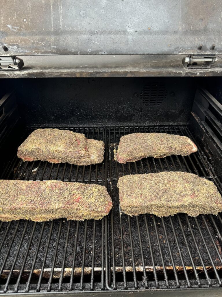 Beef ribs on my Camp Chef DLX. 250 for 6.5 hours until temp was 206. Melted like butter in my mouth.