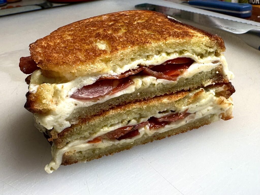 Mozzarella, pesto, and salami melt.