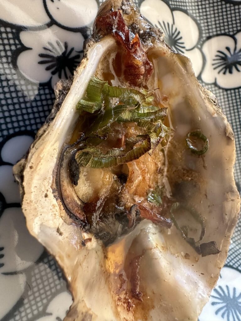 Smoked Oysters with bacon and a Brown-sugar, Bourbon Chipotle butter