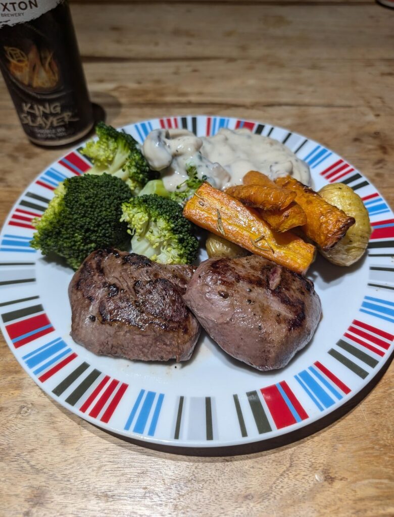 Little Friday night treat. Venison steaks, rosemary roasted carrots and new potatoes, broccoli and creamy garlic mushrooms