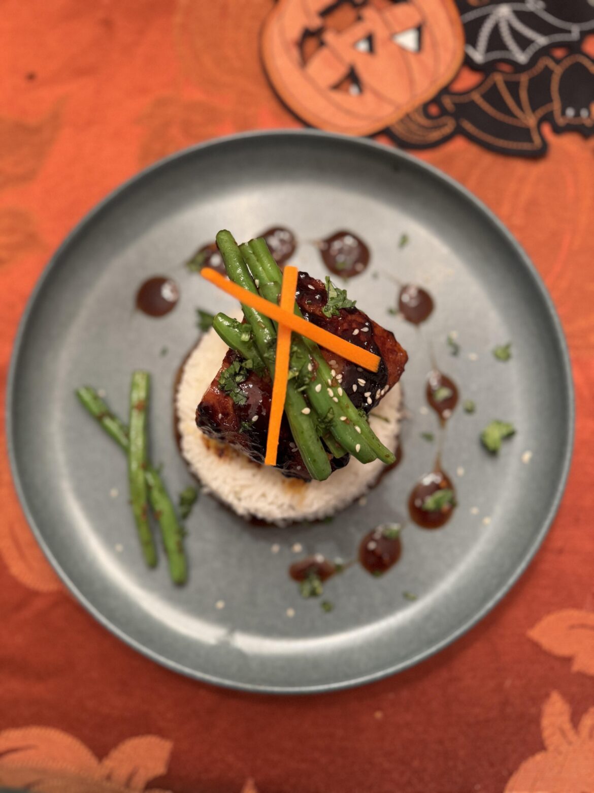Sticky bourbon porkbelly, with ginger soy green beans, jasmine rice, pickled carrots, spicy honey and soy sauce drops.