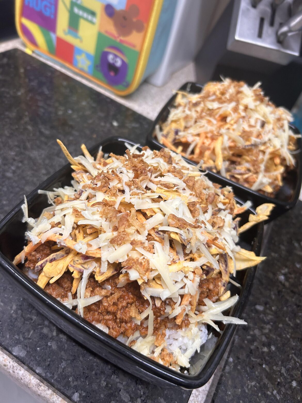 Super quick beef and pork cheeseburger inspired rice bowl with burger sauce slaw, cheese and crispy onions 🥩 🍔 🍚 🧀 🧅