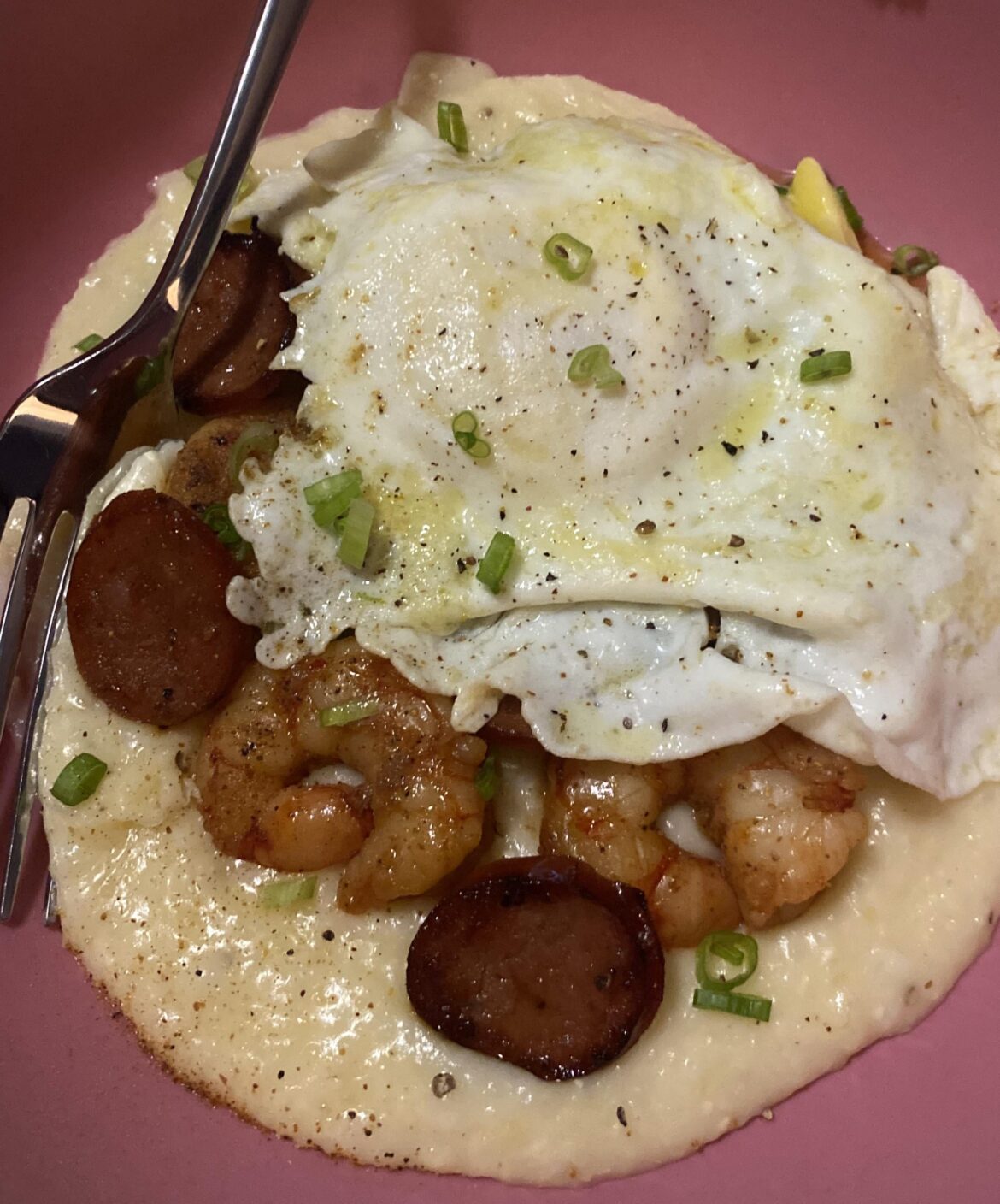 shrimp and grits, andouille, green onion, creole seasoning, and an egg (plus cheddar green onion biscuits on the side)