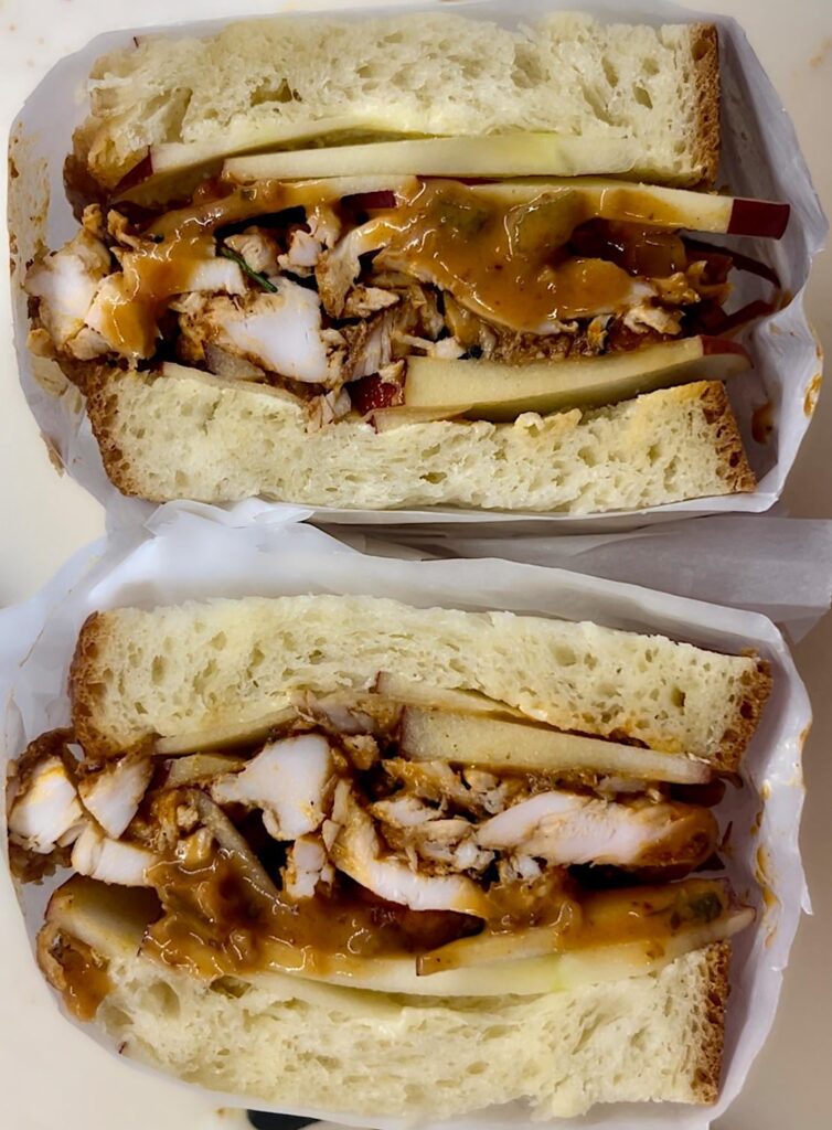 Another fresh challah means: Nashville hot chicken shawarma, sliced Cosmic Crisp apples, honey butter, and a honey-chipotle tomato mayo.