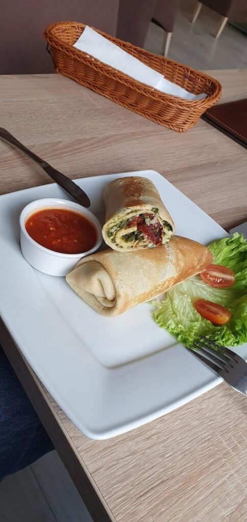 Crepe with salmon, cheese, spinach, dried tomato