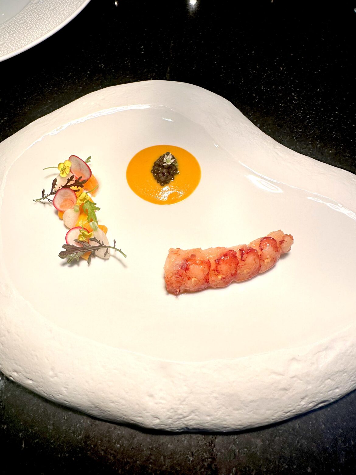 Lobster with coconut curry squash veloute, caviar, squash and turnip
