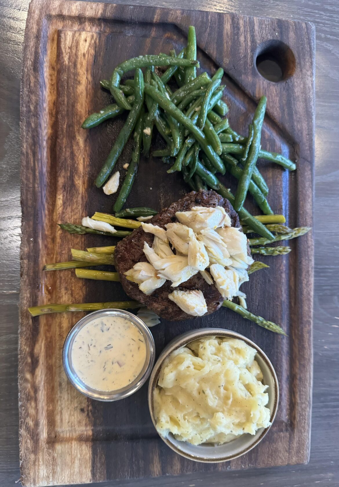Fancy steak dinner on a cutting board, please.