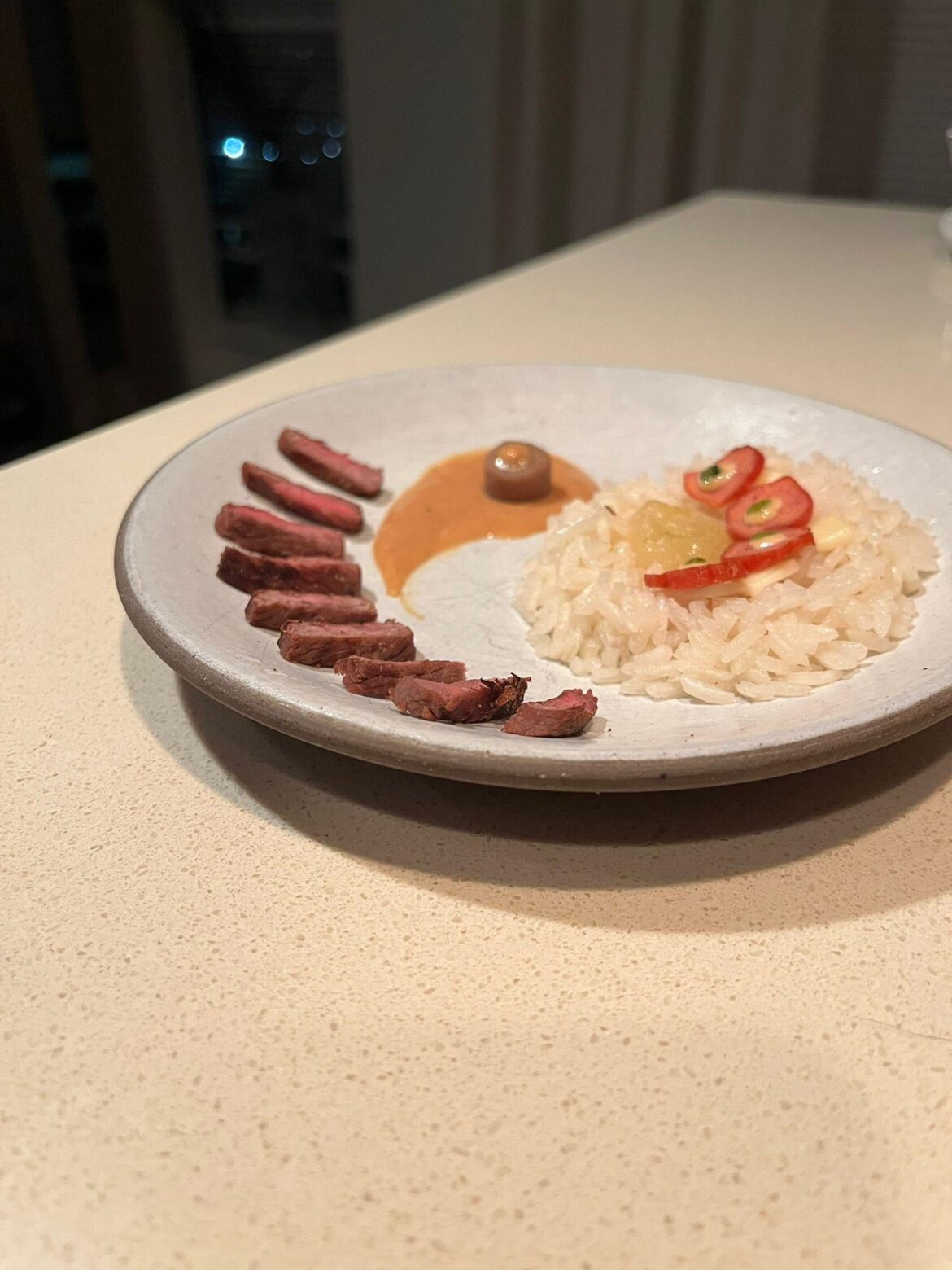 Steak and rice, alongside assorted grains, pepperoni and cheese. Finished  with a peanut butter and fish oil sauce.