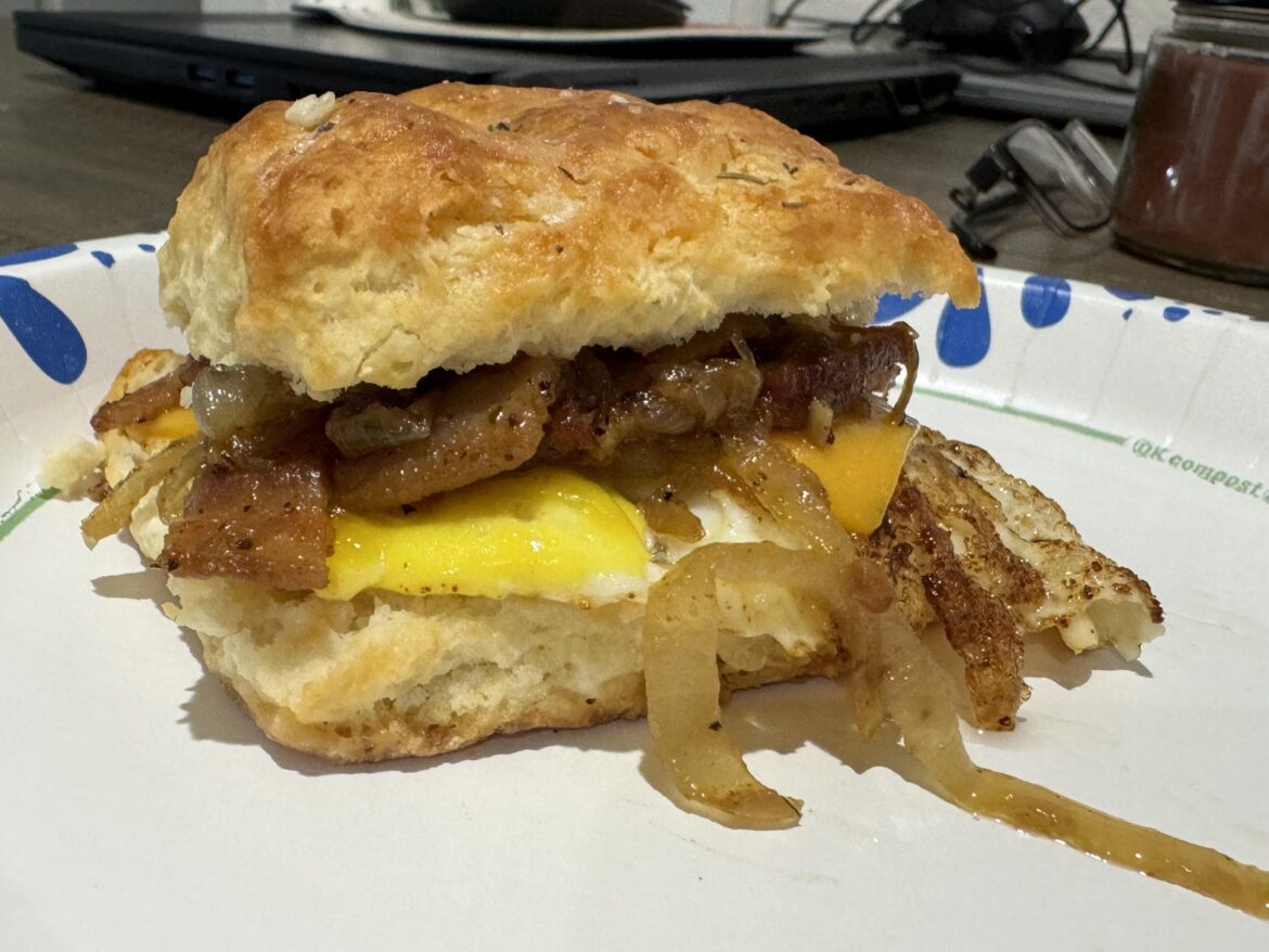 Labor of love this morning: Egg, cheese, bacon onion jam on a homemade biscuit.