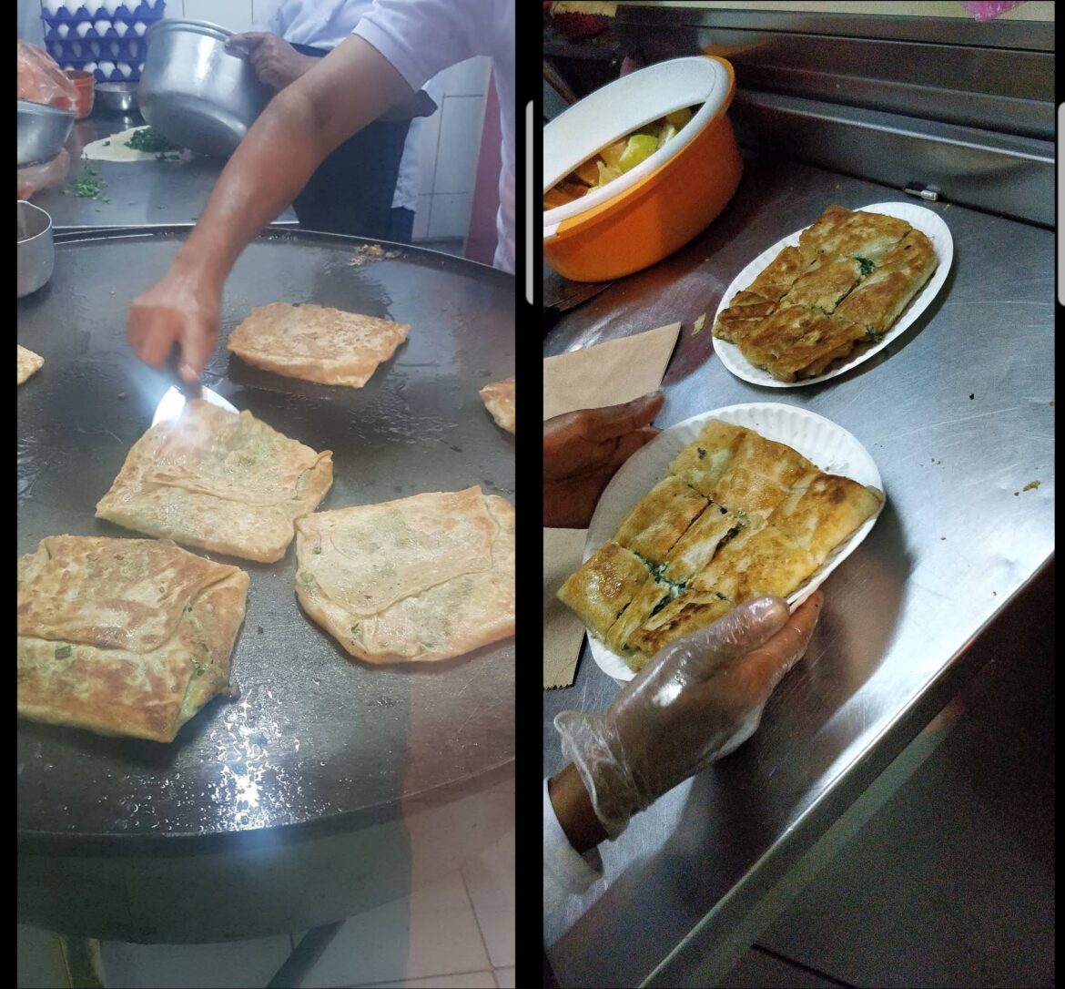 Mutabak (very thin dough stuffed with chives green onions beaten eggs ground beef goes amazing with a squeeze of lemon) This place has been making it for +30 years in my small town. I miss home already . Saihat Eastern Saudi Arabia