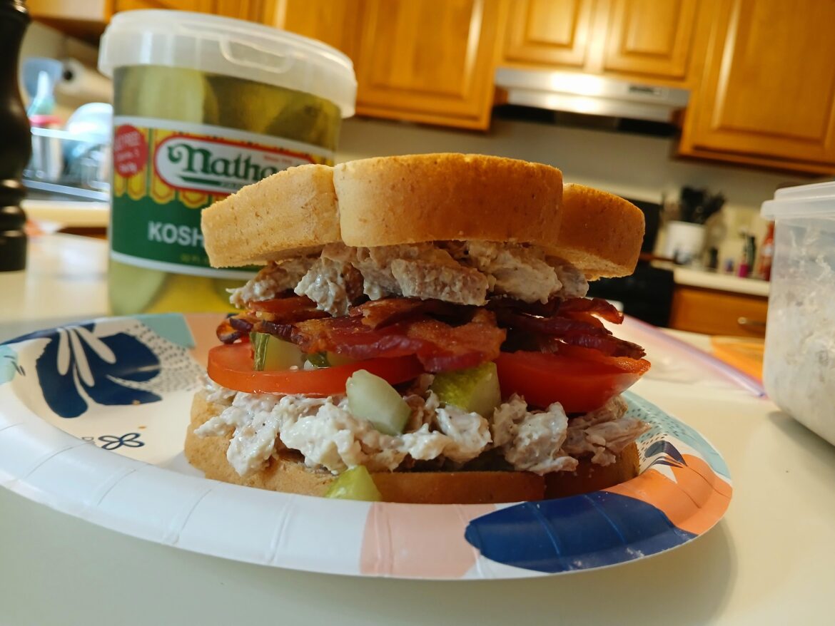 Chicken salad with bacon, tomato and pickles, on honey wheat. 👌🤌