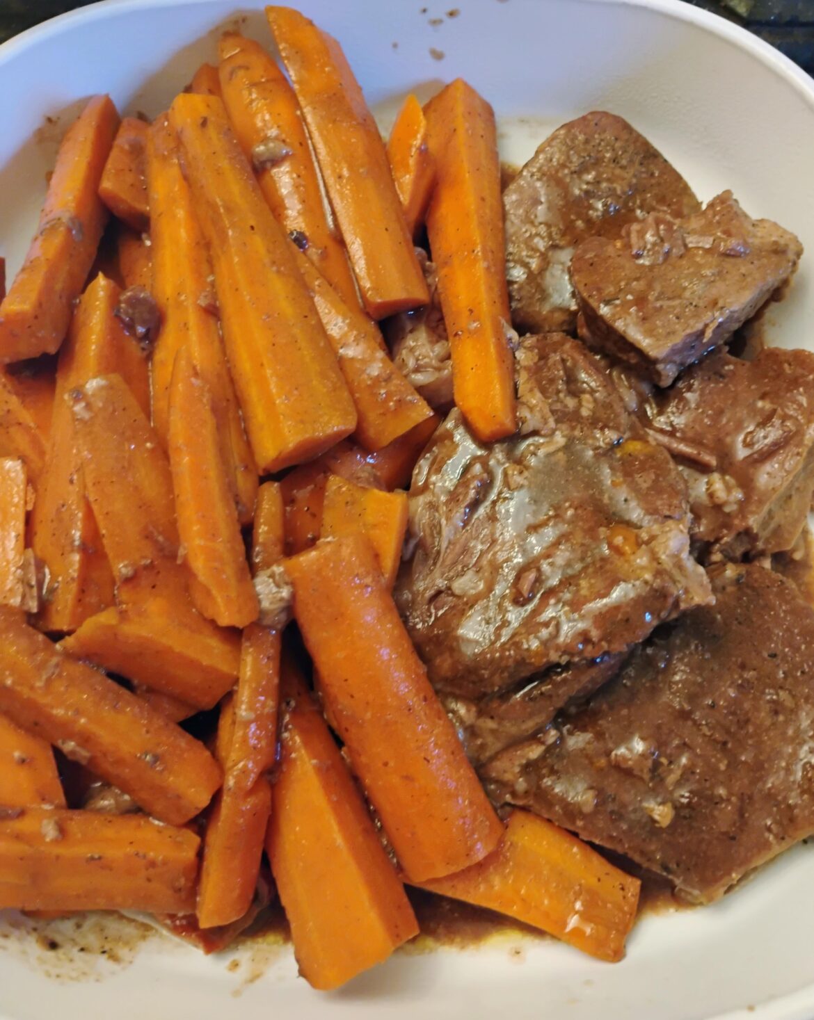 Chuck steak and carrots in gravy with spices. 6 hours on low.