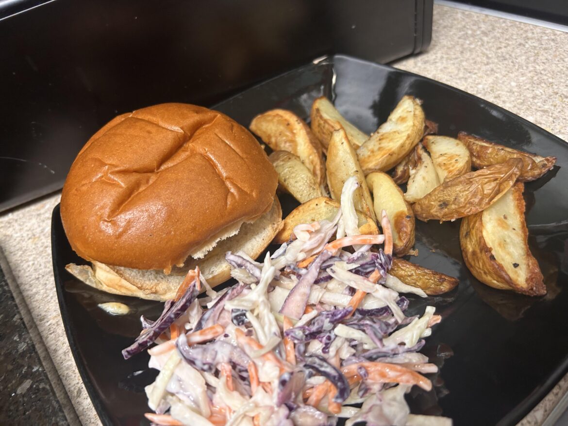 Family favourite cheddar cheeseburger with wedges and roasted garlic slaw ❤️ 🧀 🍔 🧄