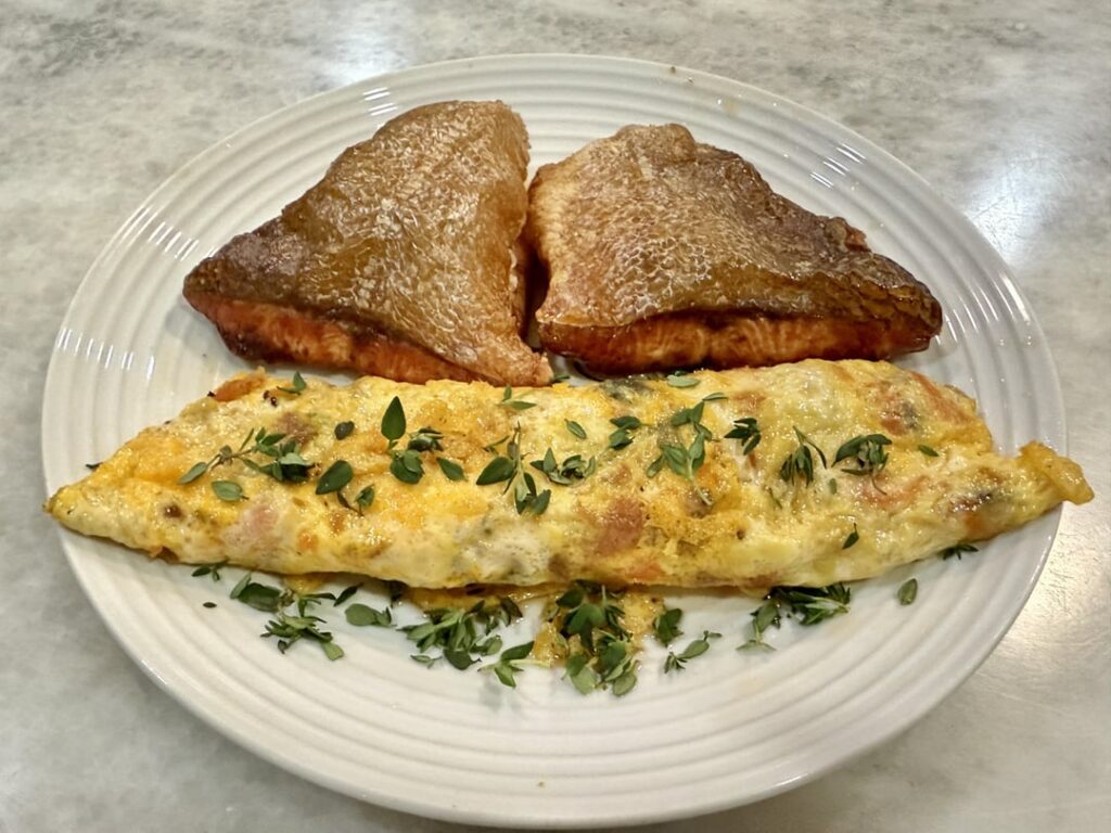 Keto lunch - Pan Seared Salmon with Salmon Eggs Roll, accompanied by Garlic Butter Steamed Broccoli.