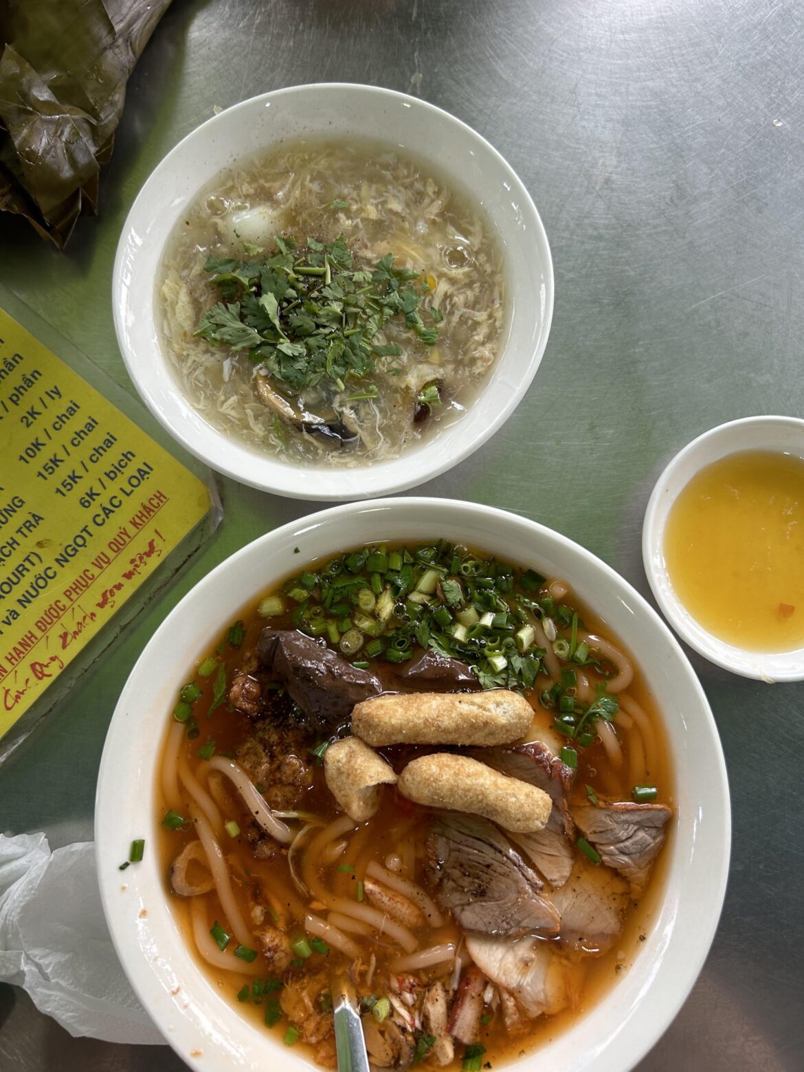 Crab udon noodle (banh can cua) with huge chunks of crab and a seafood soup in Saigon