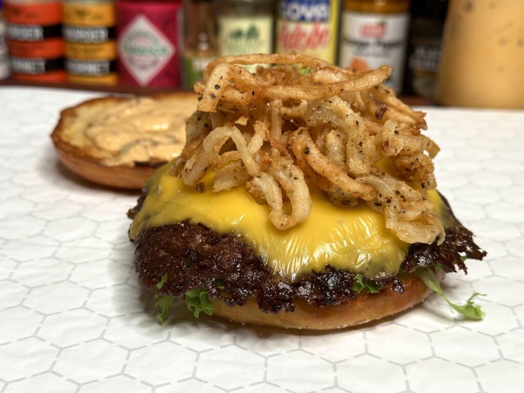Smash burger with fried onion strings