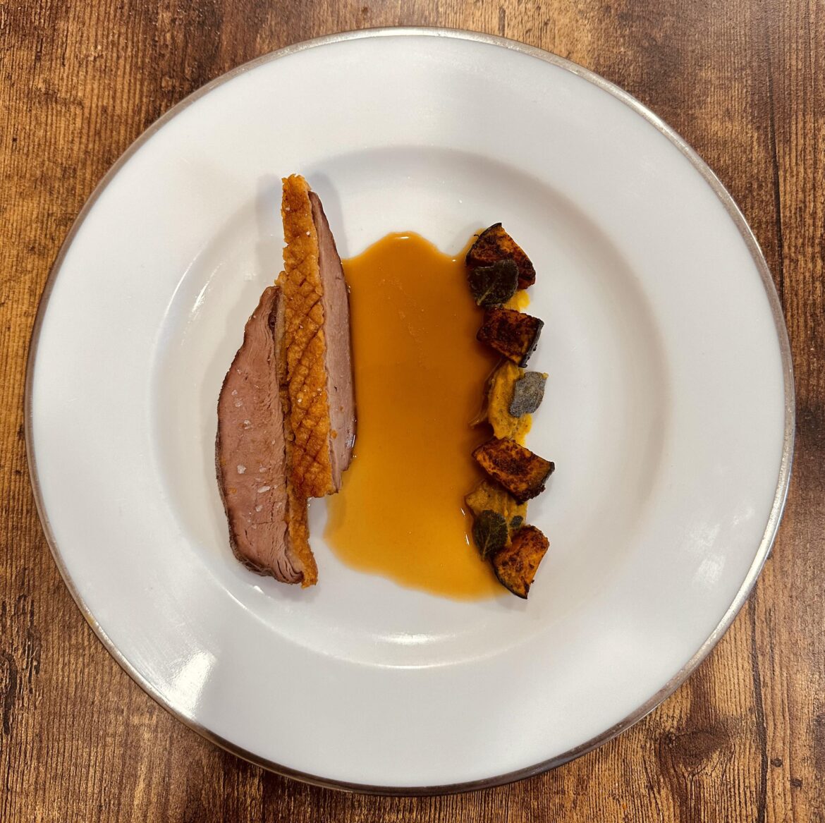 Smoked duck breast with kabocha, orange squash purée, brown butter sage and duck Demi glacé