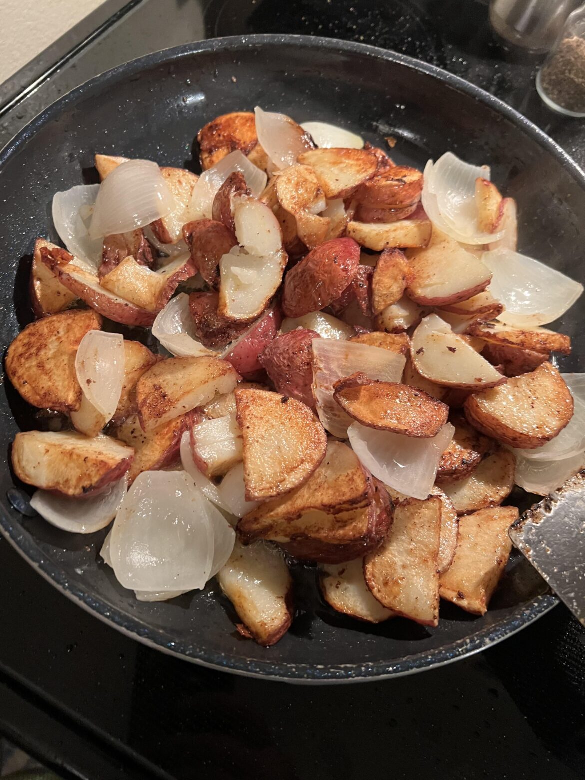A few potatoes in my fried onions!