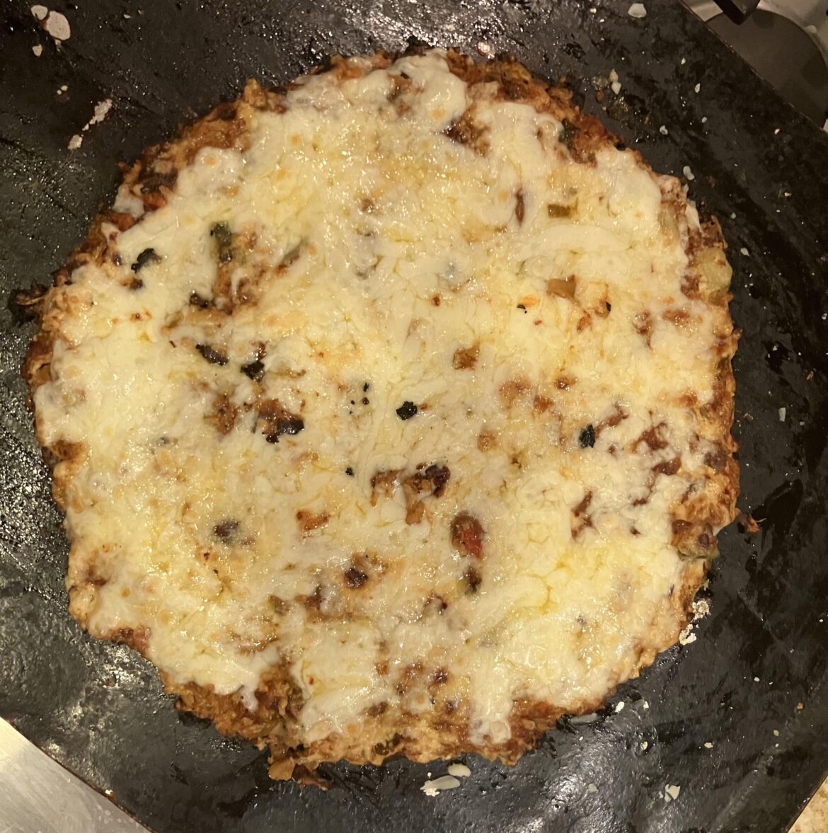 Kimchi pizza with kimchi-infused Alfredo sauce.